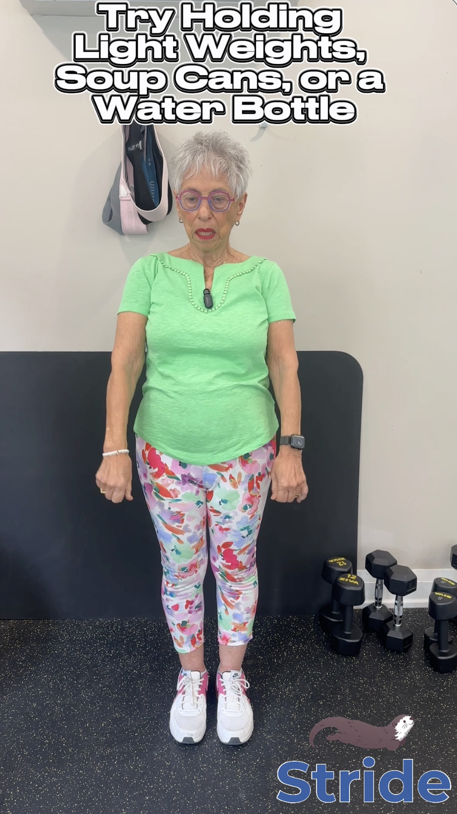 Older adult doing a Stride exercise with light weights